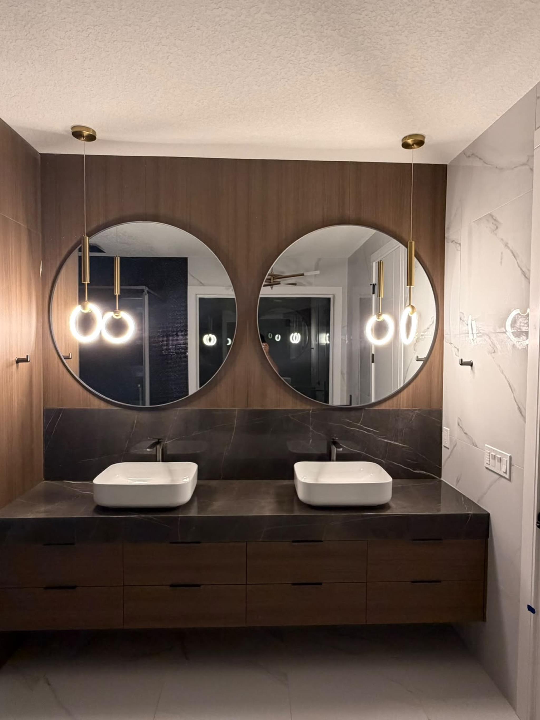 Dark floating double vanity with drawers.