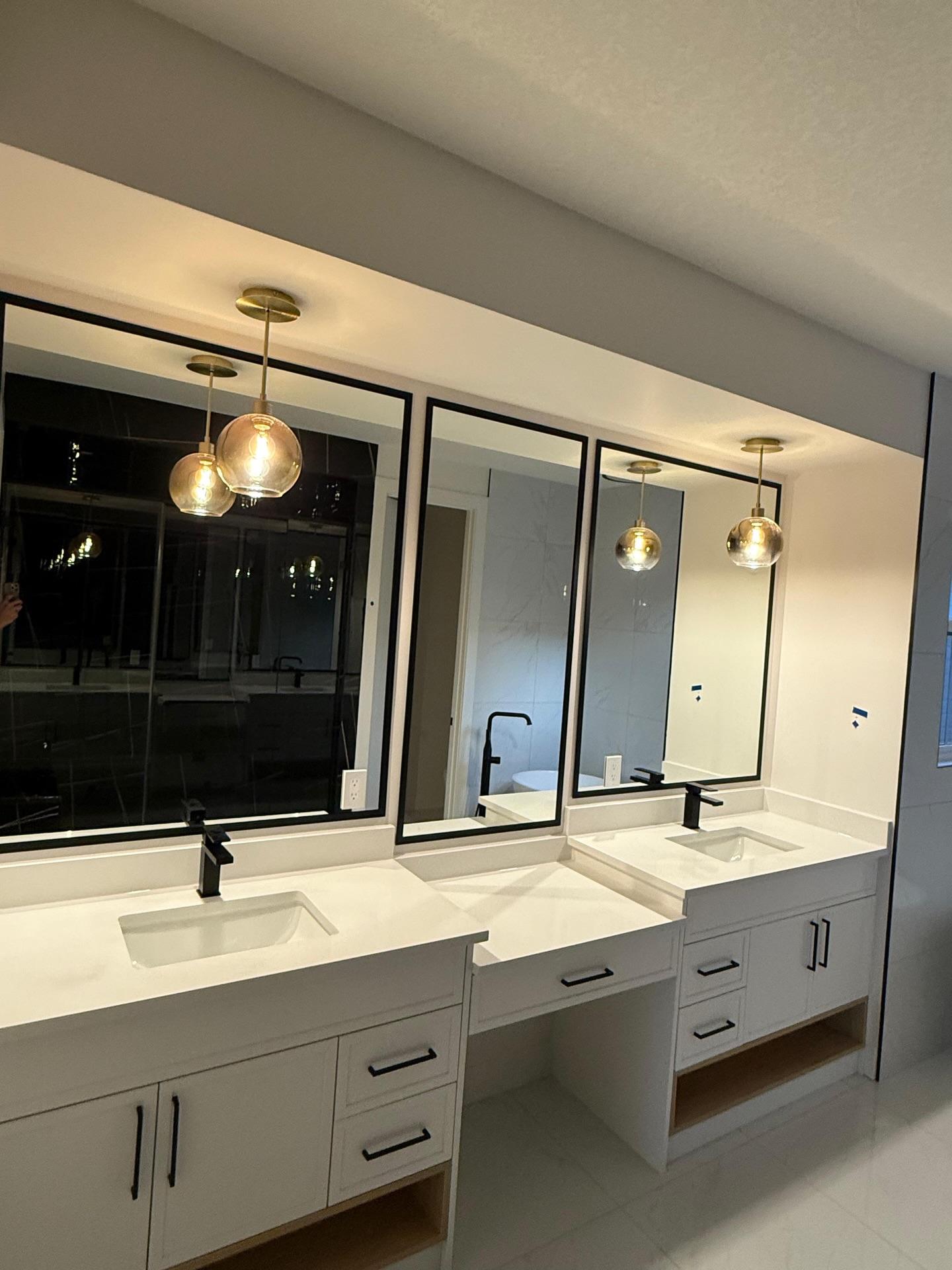 White double vanity with cabinet storage.